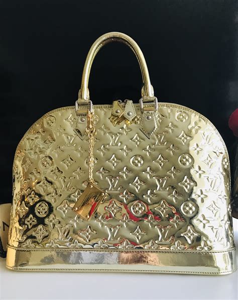 gold Louis Vuitton bag